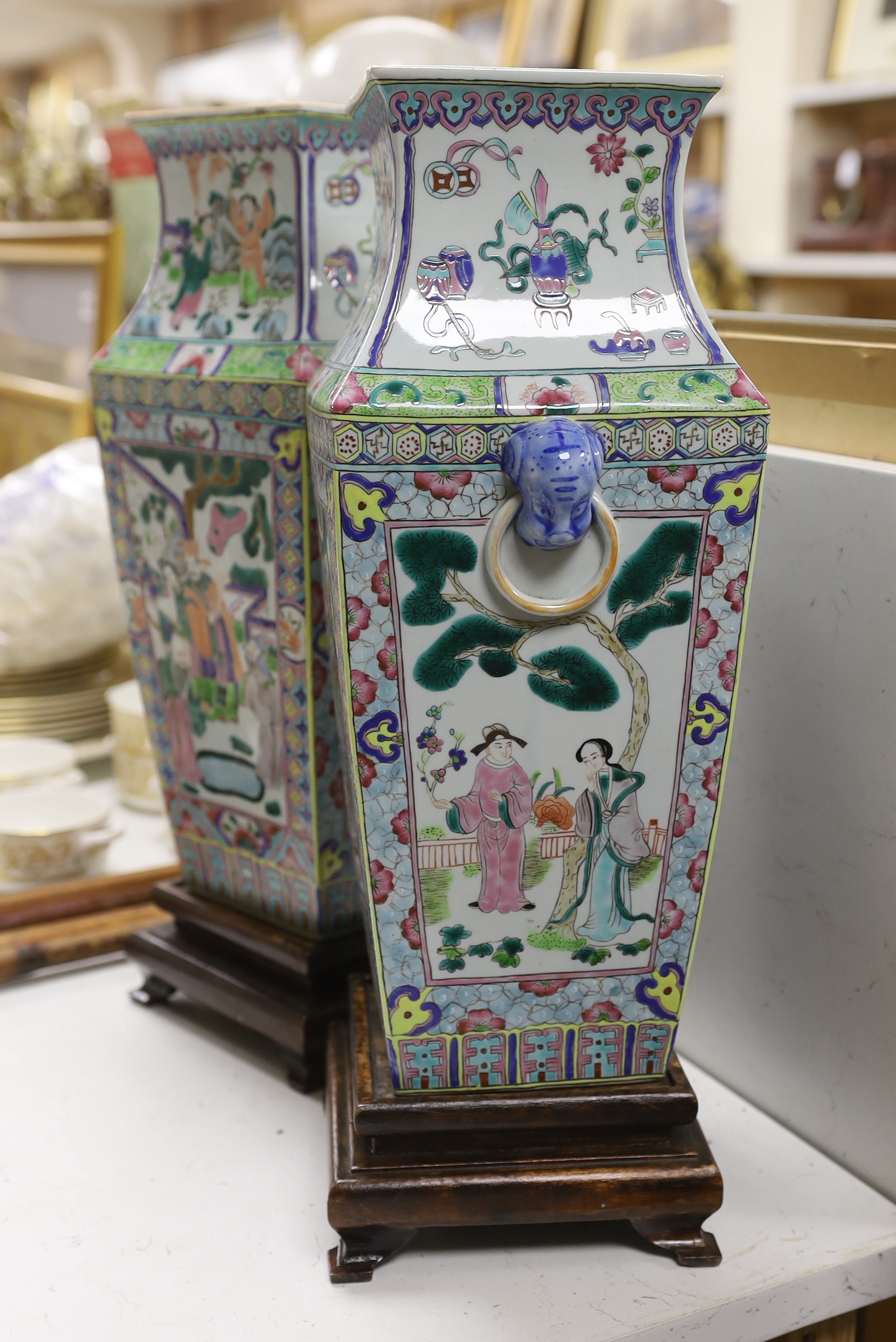 A pair of Chinese famille rose vases, on stands, 49cm total height